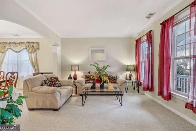 carpeted living room with plenty of natural light and crown molding