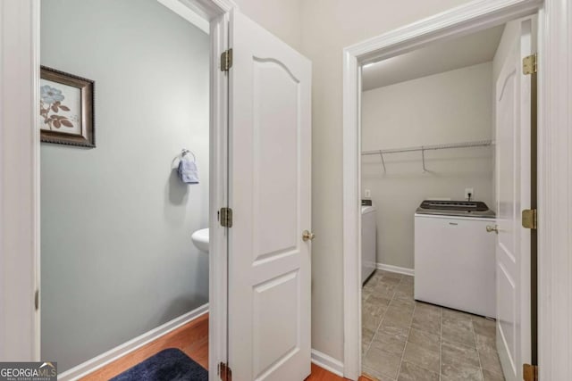 bathroom with separate washer and dryer