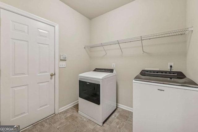 clothes washing area featuring washing machine and dryer