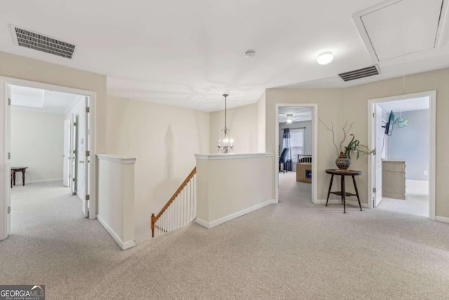 hall featuring light colored carpet