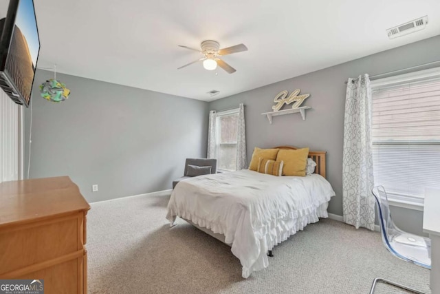 carpeted bedroom featuring ceiling fan