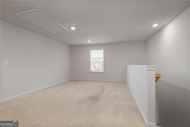 unfurnished room featuring light carpet and ceiling fan