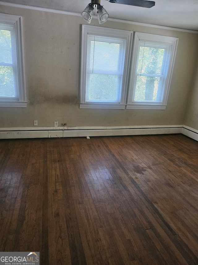 unfurnished room with a baseboard radiator, crown molding, ceiling fan, and dark wood-type flooring