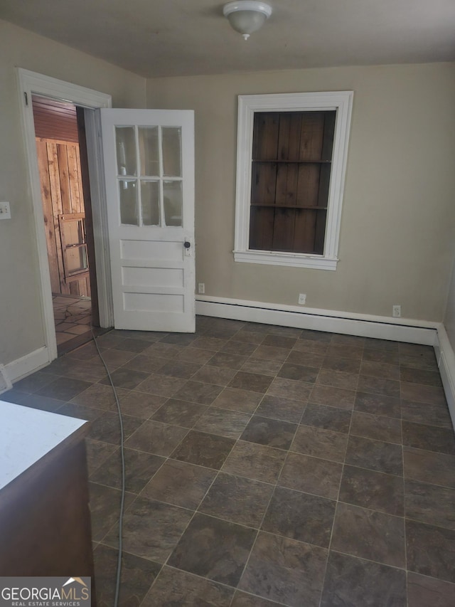 spare room featuring a baseboard radiator