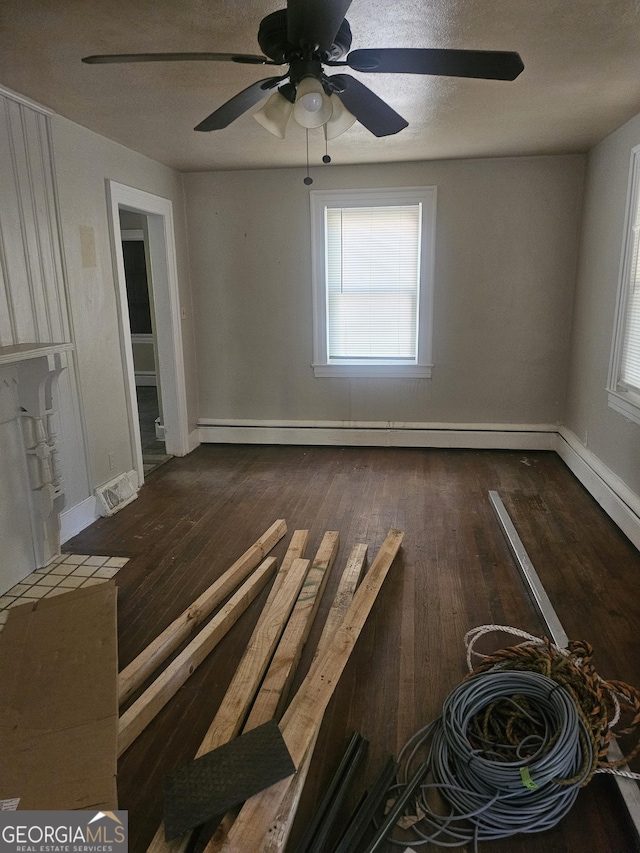 interior space featuring dark hardwood / wood-style floors and a baseboard radiator