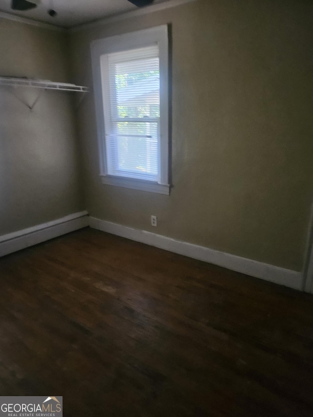 unfurnished room featuring dark hardwood / wood-style floors