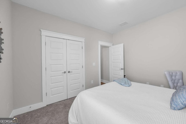 carpeted bedroom featuring a closet