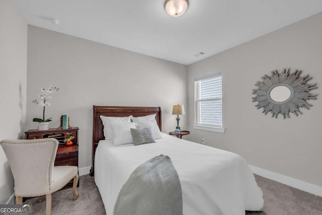 bedroom with light colored carpet