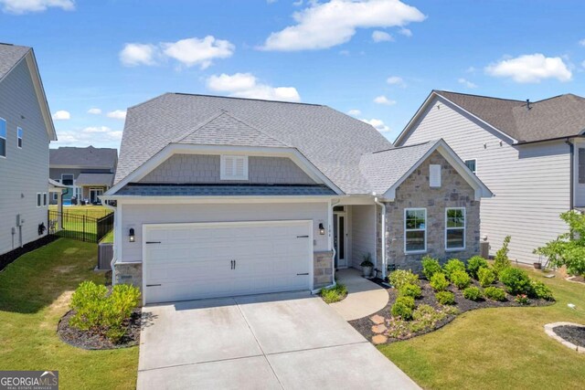 craftsman-style house with a front yard