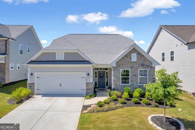 craftsman inspired home featuring a front yard and a garage