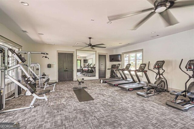 exercise room featuring ceiling fan and carpet floors