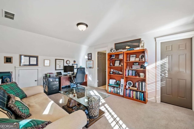 carpeted office space with lofted ceiling