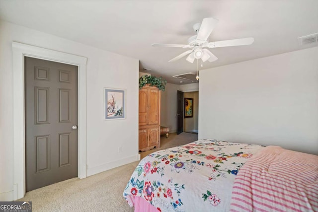 bedroom featuring ceiling fan and light carpet