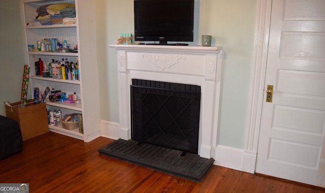 living room with dark hardwood / wood-style flooring