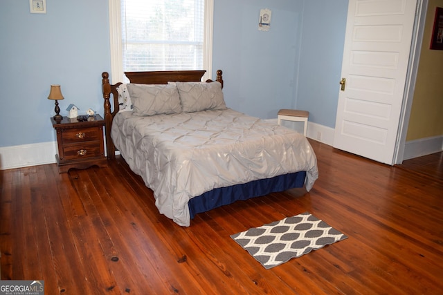 bedroom featuring dark wood-type flooring