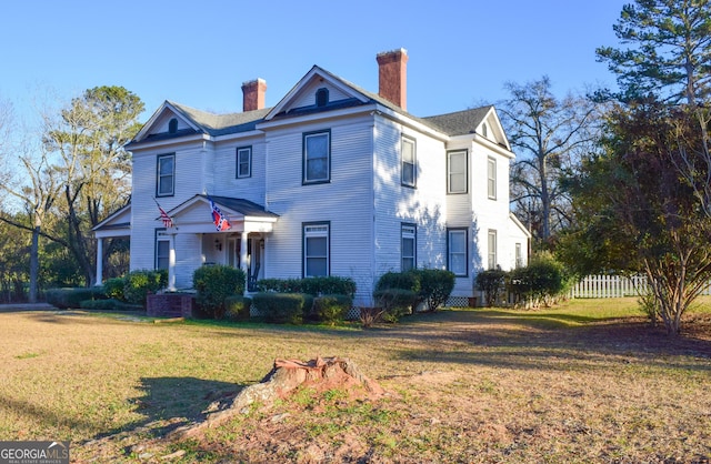 view of front of home with a front yard