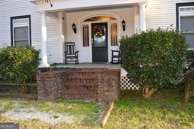 entrance to property featuring a porch