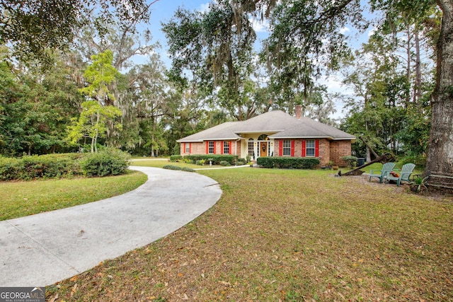 ranch-style house with a front lawn