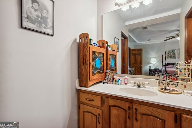 bathroom with ceiling fan and vanity