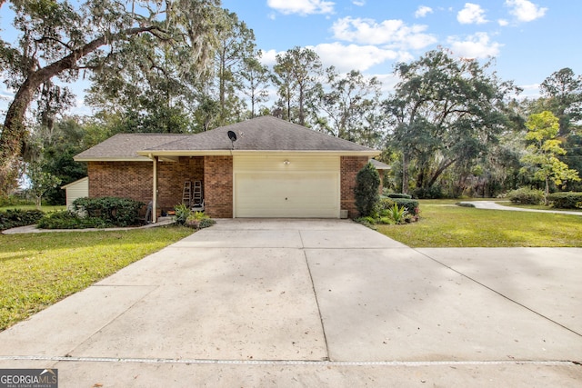 ranch-style home with a garage and a front lawn