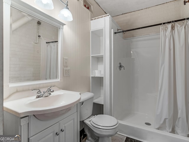 bathroom featuring vanity, toilet, and a shower with shower curtain