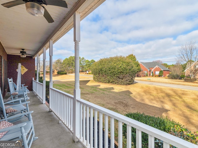 balcony featuring ceiling fan and a porch