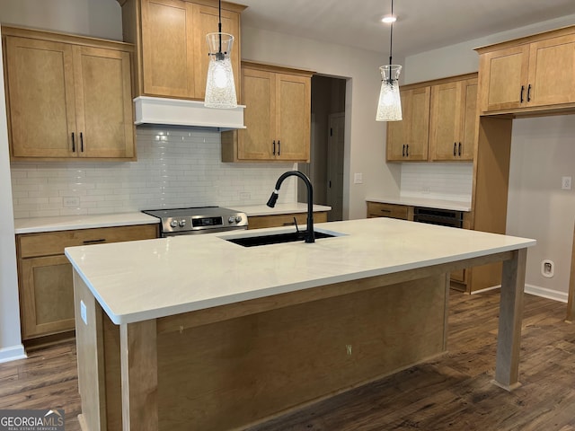 kitchen featuring electric range, dark wood-style floors, custom exhaust hood, pendant lighting, and a sink