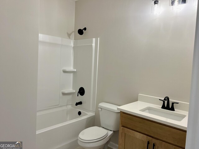 bathroom featuring shower / bathing tub combination, toilet, and vanity