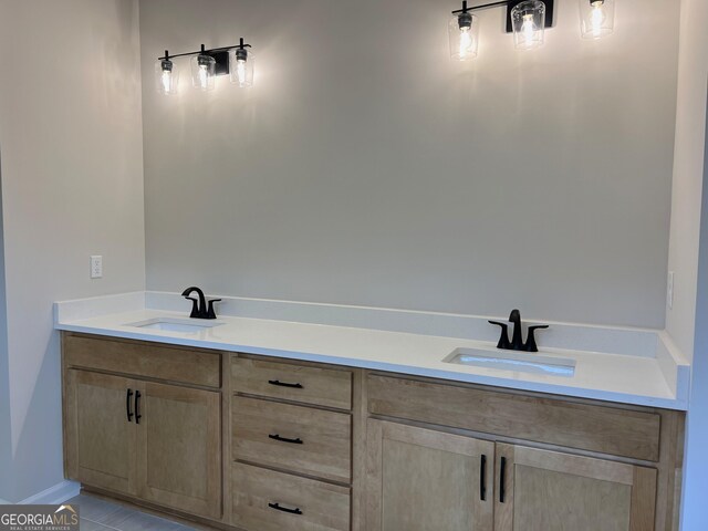 bathroom featuring double vanity and a sink