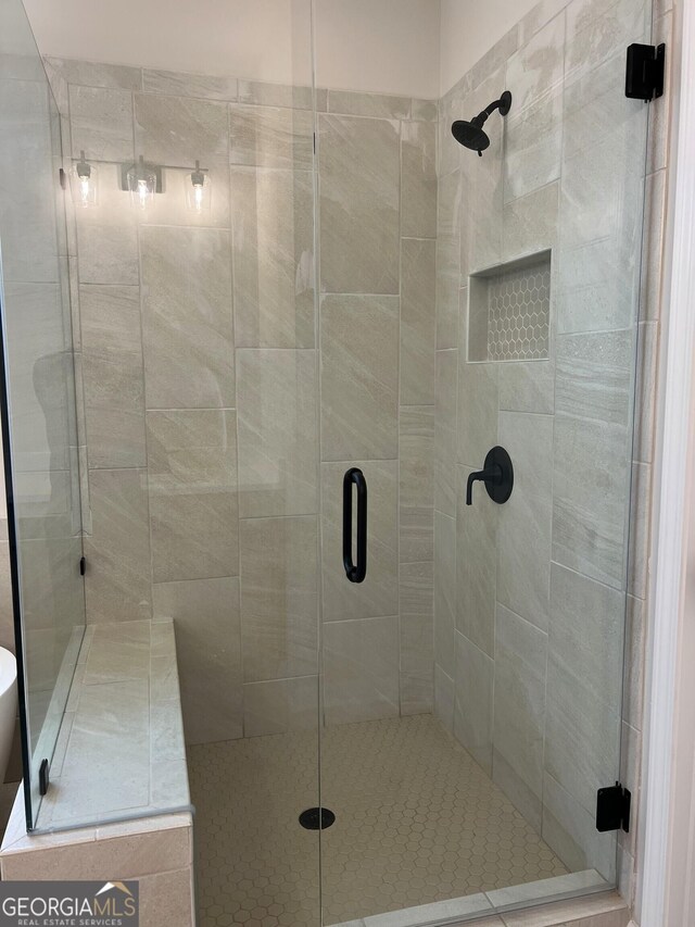 full bathroom with a shower stall