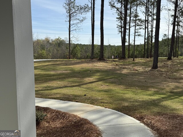 view of yard featuring a view of trees