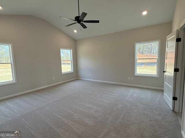 carpeted empty room featuring baseboards, lofted ceiling, ceiling fan, and recessed lighting