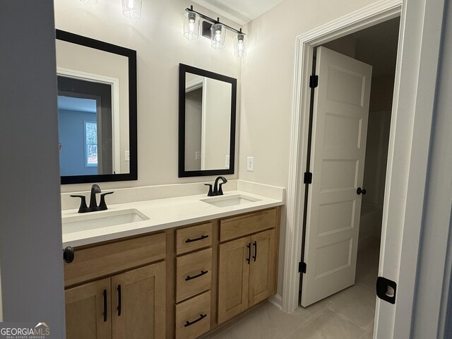 bathroom featuring double vanity and a sink