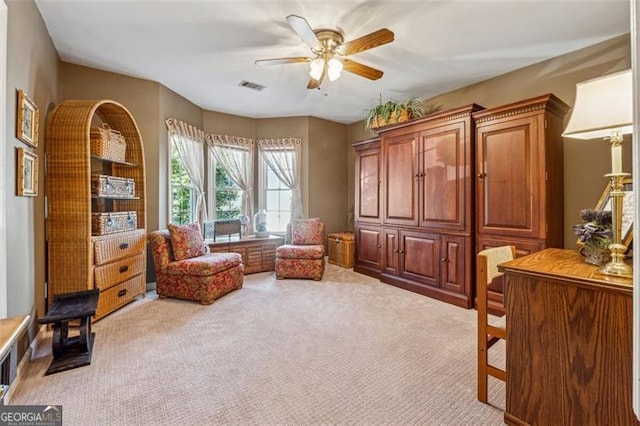 sitting room with carpet flooring and ceiling fan