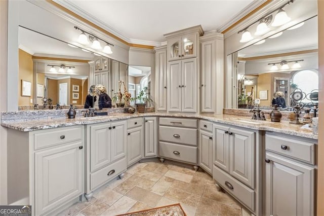 bathroom featuring vanity and ornamental molding