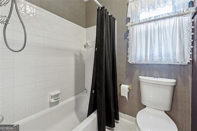 bathroom featuring toilet and shower / tub combo with curtain