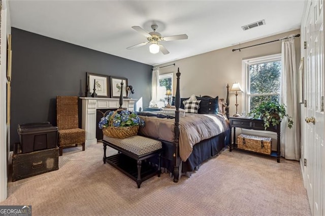 carpeted bedroom with ceiling fan