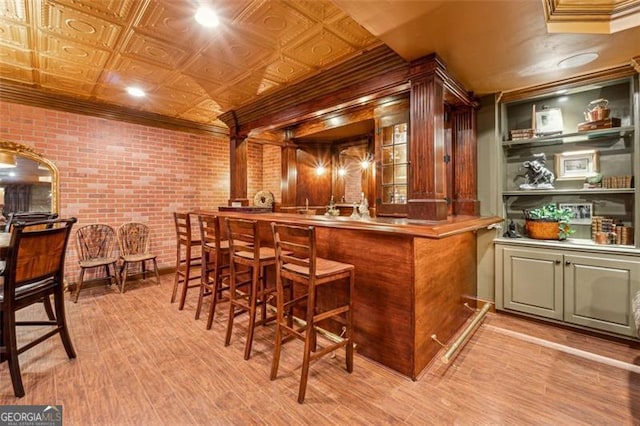 bar with light wood-type flooring