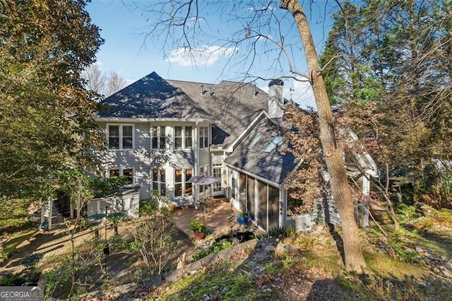 back of property featuring a sunroom