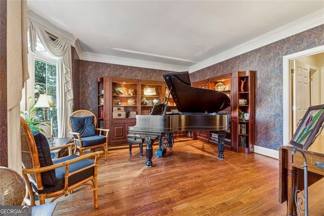 interior space featuring wood-type flooring and ornamental molding