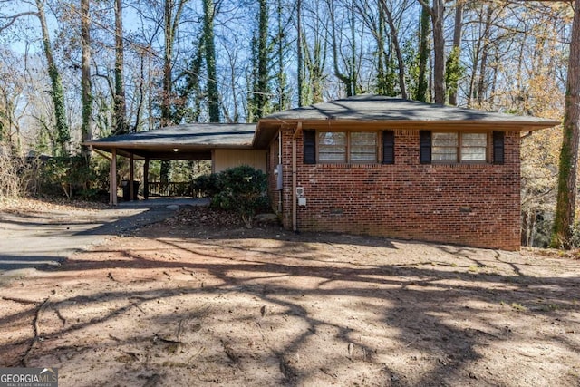 view of front of home with a carport