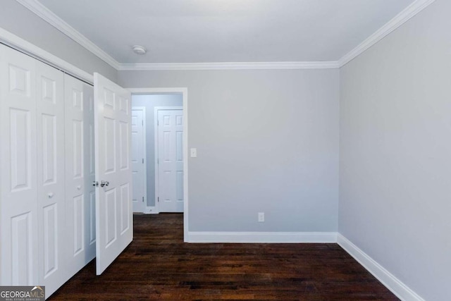 unfurnished bedroom featuring a closet, dark hardwood / wood-style flooring, and ornamental molding