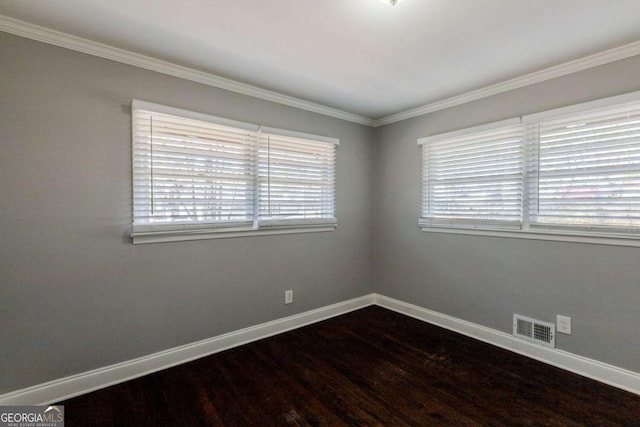 spare room with hardwood / wood-style flooring and ornamental molding