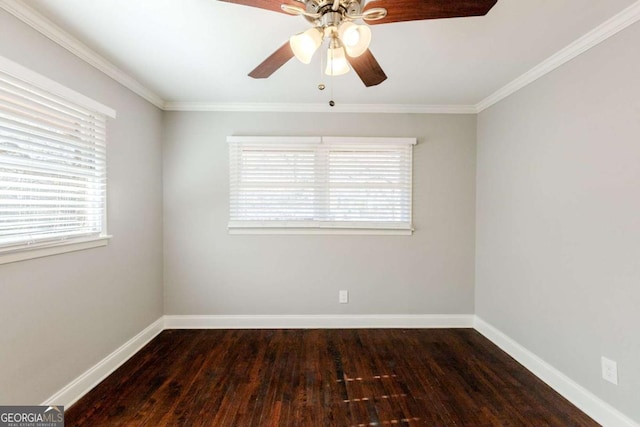 unfurnished room with dark wood-type flooring, crown molding, and a healthy amount of sunlight