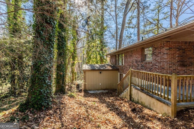 view of side of home featuring a storage shed