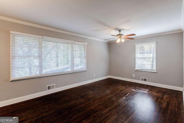 spare room featuring dark hardwood / wood-style flooring, ceiling fan, and ornamental molding