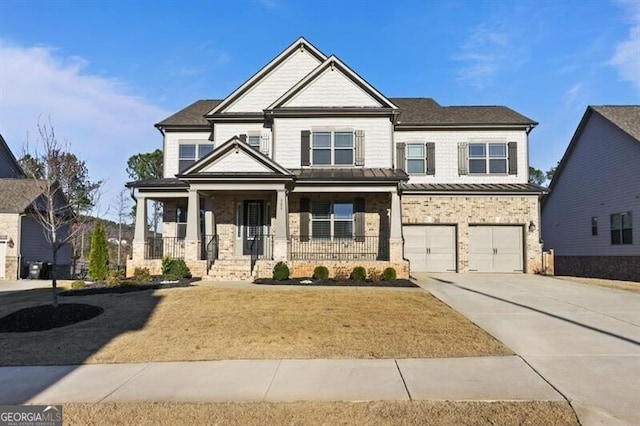 craftsman inspired home with a porch and a garage