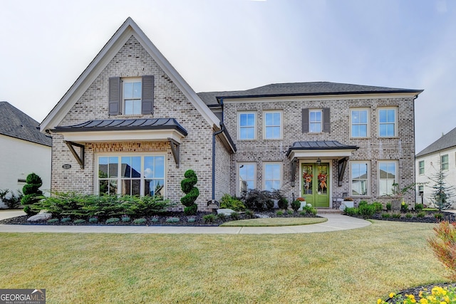 view of front of house with french doors and a front lawn