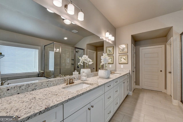 bathroom featuring tile patterned floors, vanity, and an enclosed shower