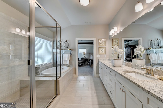 bathroom with tile patterned flooring, plus walk in shower, plenty of natural light, and lofted ceiling